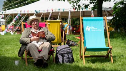 An attendee relaxes at the 2024 Hay Festival in Hay-on-Wye, Wales