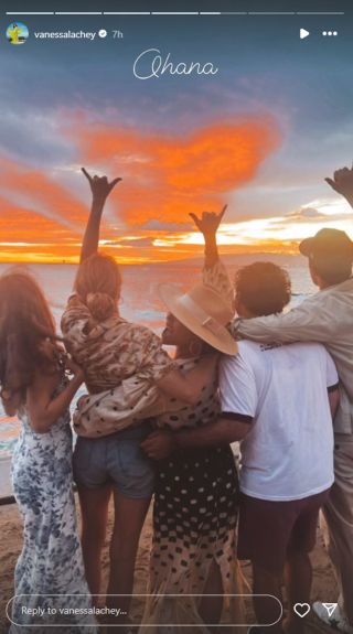 NCIS: Hawai’i cast not facing the camera holding their hands up making hang loose signs with the sunset behind them.