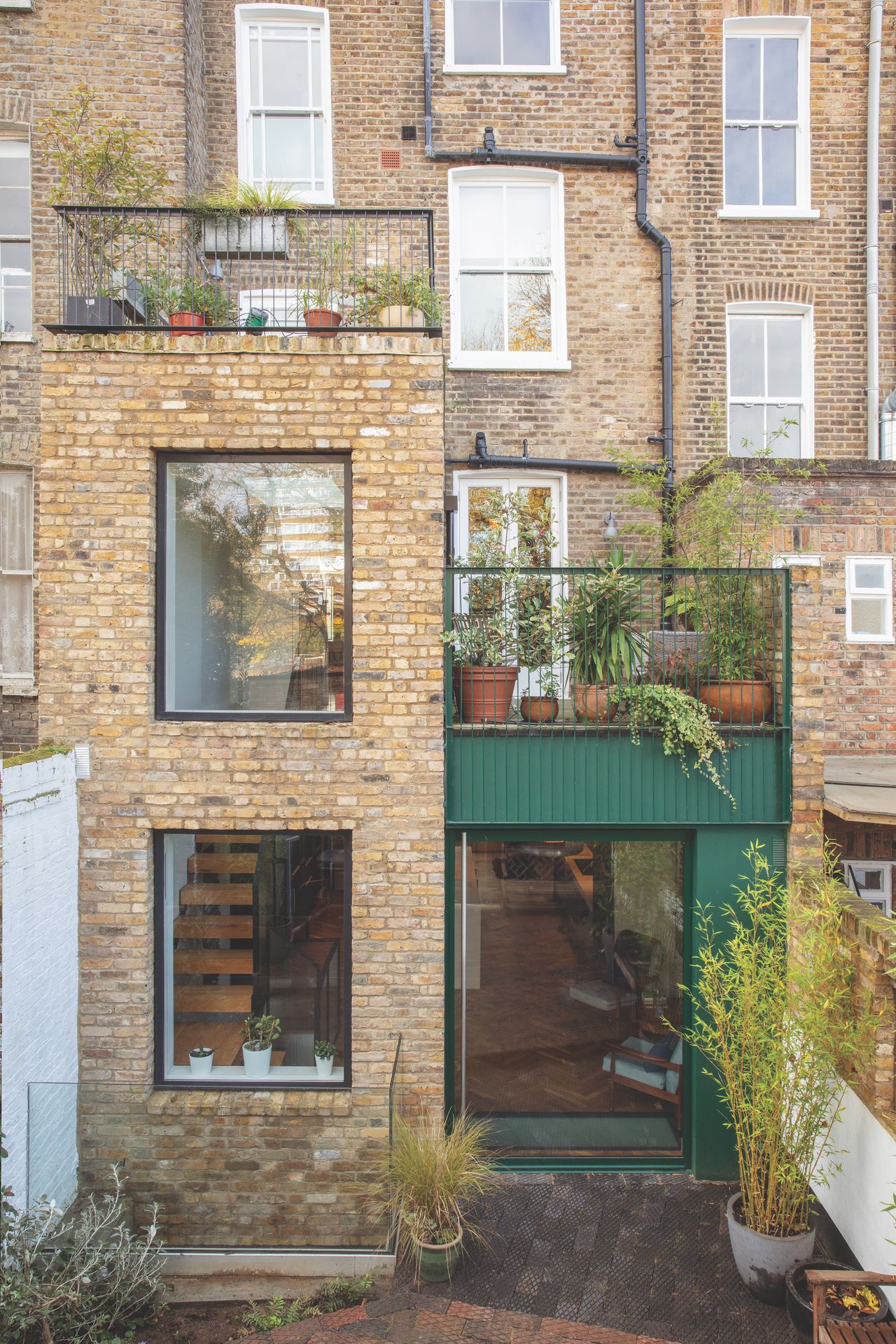 green clad extension to tall terrace house