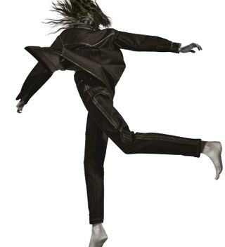 Girl hopping in dark denim pants and top