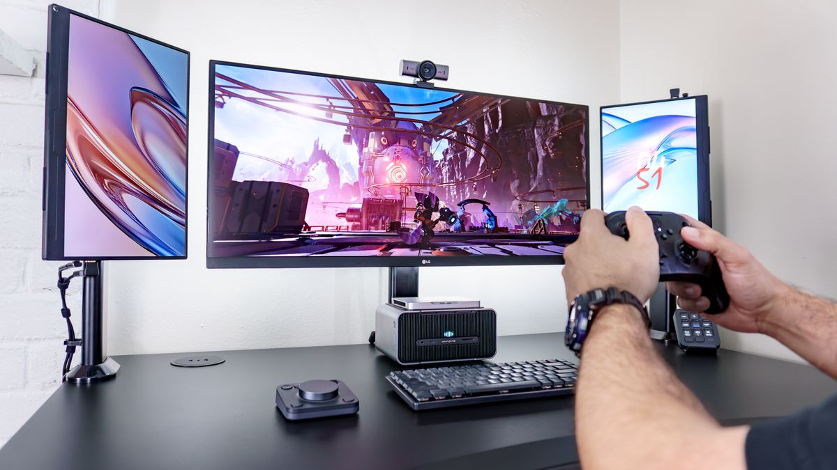 A person playing video games on the Khadas Mind 2S with a graphics boost from the Mind Graphics 2