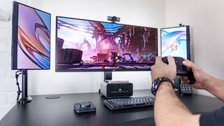 A person playing video games on the Khadas Mind 2S with a graphics boost from the Mind Graphics 2