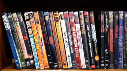 A row of DVDs on a shelf