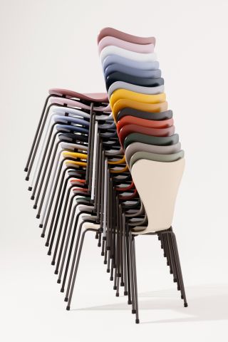 A stack of multi-coloured Arne Jacobsen chairs