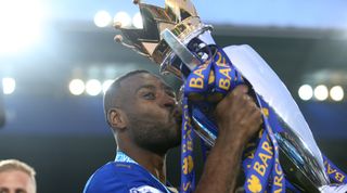 LEICESTER, ENGLAND - MAY 07 : Captain Wes Morgan of Leicester City kisses the Premier League trophy after the Barclays Premier League match between Leicester City and Everton at the King Power Stadium on May 7, 2016 in Leicester, United Kingdom. (Photo by Plumb Images/Leicester City FC via Getty Images)
