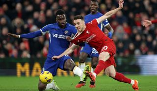 Diogo Jota of Liverpool scores his team&#039;s first goal whilst under pressure from Benoit Badiashile