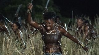 Viola Davis as General Nanisca charging into battle in The Woman King