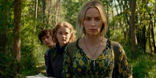 A Quiet Place Part II Emily Blunt and her on-screen children walking in the forest