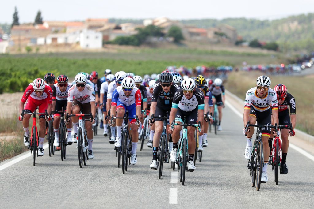 ALTO DE LA MONTAA DE CULLERA SPAIN AUGUST 19 LR Eddy Fin of France and Team Cofidis Damien Touz of France and AG2R Citren Team Jacopo Guarnieri of Italy and Team Groupama FDJ Robert Stannard of Australia and Team BikeExchange and Maximilian Schachmann of Germany and Team Bora Hansgrohe attack at firsts kilometres of the stage during the 76th Tour of Spain 2021 Stage 6 a 1583km stage from Requena to Alto de la Montaa de Cullera 184m lavuelta LaVuelta21 on August 19 2021 in Alto de la Montaa de Cullera Spain Photo by Gonzalo Arroyo MorenoGetty Images