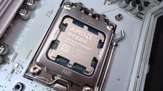 A photo of an AMD Ryzen 9 9950X3D2 Dual Edition processor mounted in a motherboard CPU socket