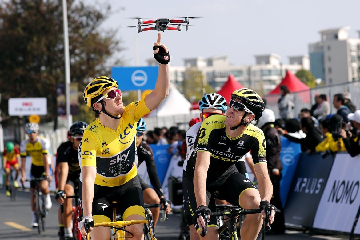 Geraint Thomas (Team Sky) tries to touch a drone
