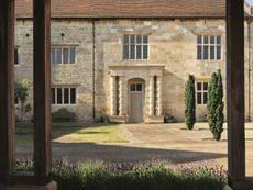 Fig 2 above: The newly built columned porch, viewed across the inner court. The gabled outline of the removed 19th-century projection is visible in the fresh masonry © Paul Highnam / Country Life