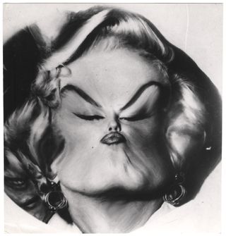 a distorted black and white photo of Marilyn Monroe