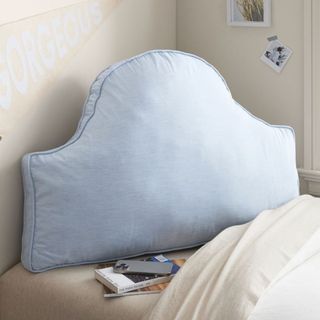 Heritage Headboard Pillow on a bed.