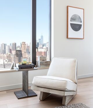 seat by window in New York apartment with interiors by Michaelis Boyd