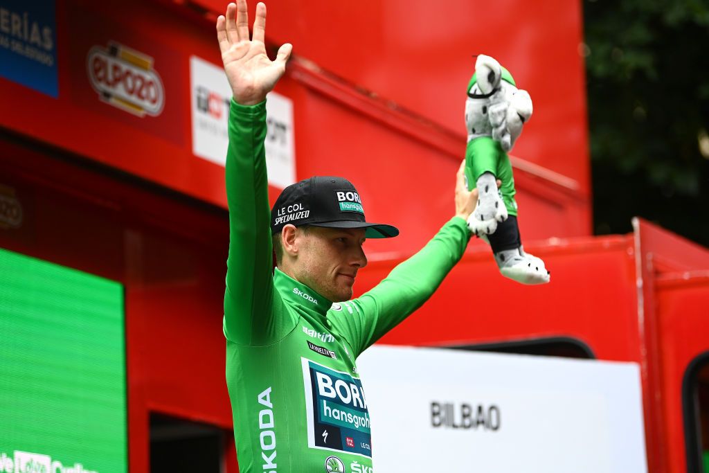 BILBAO SPAIN AUGUST 24 Sam Bennett of Ireland and Team Bora Hansgrohe celebrates winning the Green Points Jersey on the podium ceremony after the 77th Tour of Spain 2022 Stage 5 a 1872km stage from Irn to Bilbao LaVuelta22 WorldTour on August 24 2022 in Bilbao Spain Photo by Tim de WaeleGetty Images
