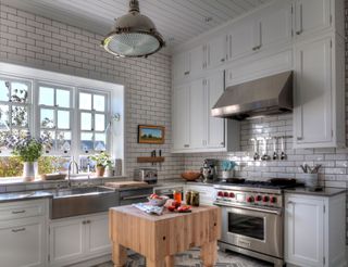 butlers pantry with butchers block and white metro tiles wooden flooring