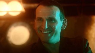 Christopher Eccleston smiling as the 9th Doctor.
