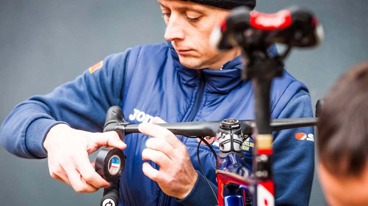 A mechanic checks the bar tape is correct