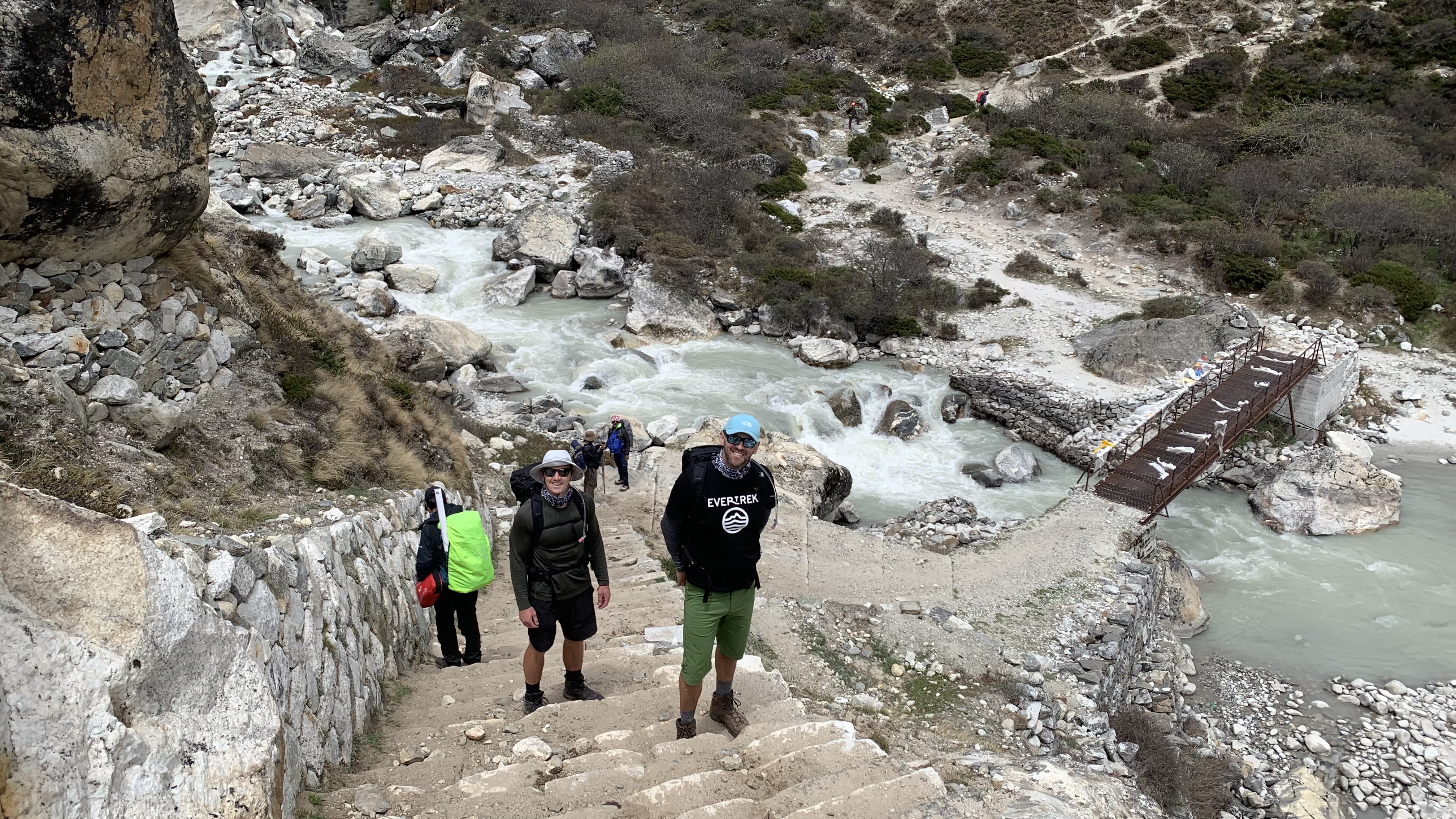 Jonathan Davies and Rhys Davis climb steps up from the Khumbu River