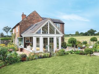 an extension with clay roof tiles matched to the original house