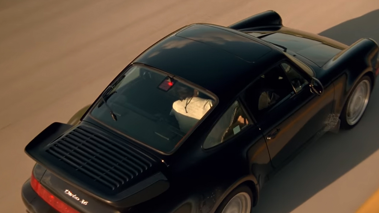 A black Porsche from above.