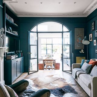 deep blue living room with sofa and furniture