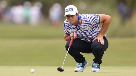 Viktor Hovland lines up a putt on the seventh green during the first round of the US Open.