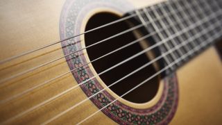 Close up of a nylon string acoustic guitar