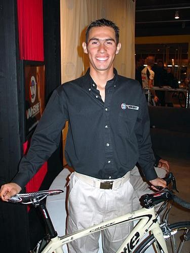 Juan Torres poses with his Whistle "Creek" bicycle.