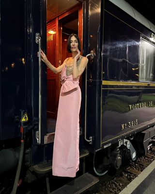 Woman wearing a pink gown.