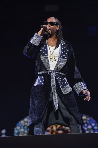 Best Coachella Fashion Looks | Guest rapper Snoop Dogg perform onstage with rapper Ice Cube during day 2 of the 2016 Coachella Valley Music & Arts Festival Weekend 1 at the Empire Polo Club on April 16, 2016 in Indio, California