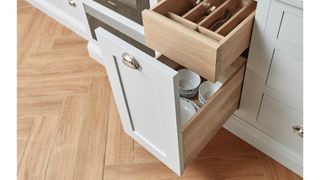 Shaker kitchen with open drawer unit to show door clearance to avoid common kitchen design mistakes
