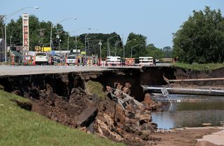 A massive sinkhole opened up on Route 62 in Oklahoma City, Oklahoma (seen here on June 2, 2013), as a result of flash floods in the area.