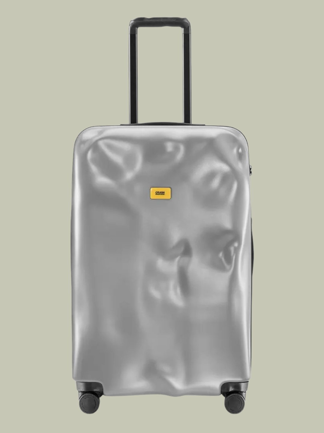 A textured silver roller suitcase from Crash Baggage