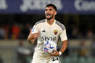 Houssem Aouar of AS Roma celebrates after scoring the team's first goal during the Serie A TIM match between Hellas Verona FC and AS Roma at Stadio Marcantonio Bentegodi on August 26, 2023 in Verona, Italy.