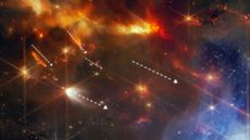 A close-up of the orange jets of gas shooting through Serpens Main