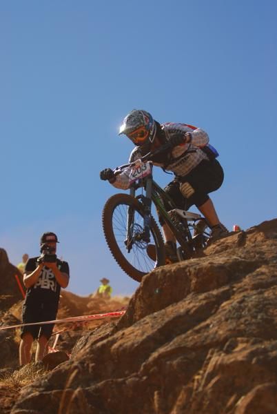 Ben Barrett crests one of the many rock drops on the downhill.