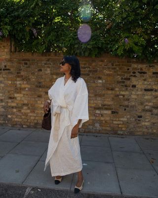 5 Spring Outfits: Chiara wears a maxi wrap dress with ballet flats and sunglasses.