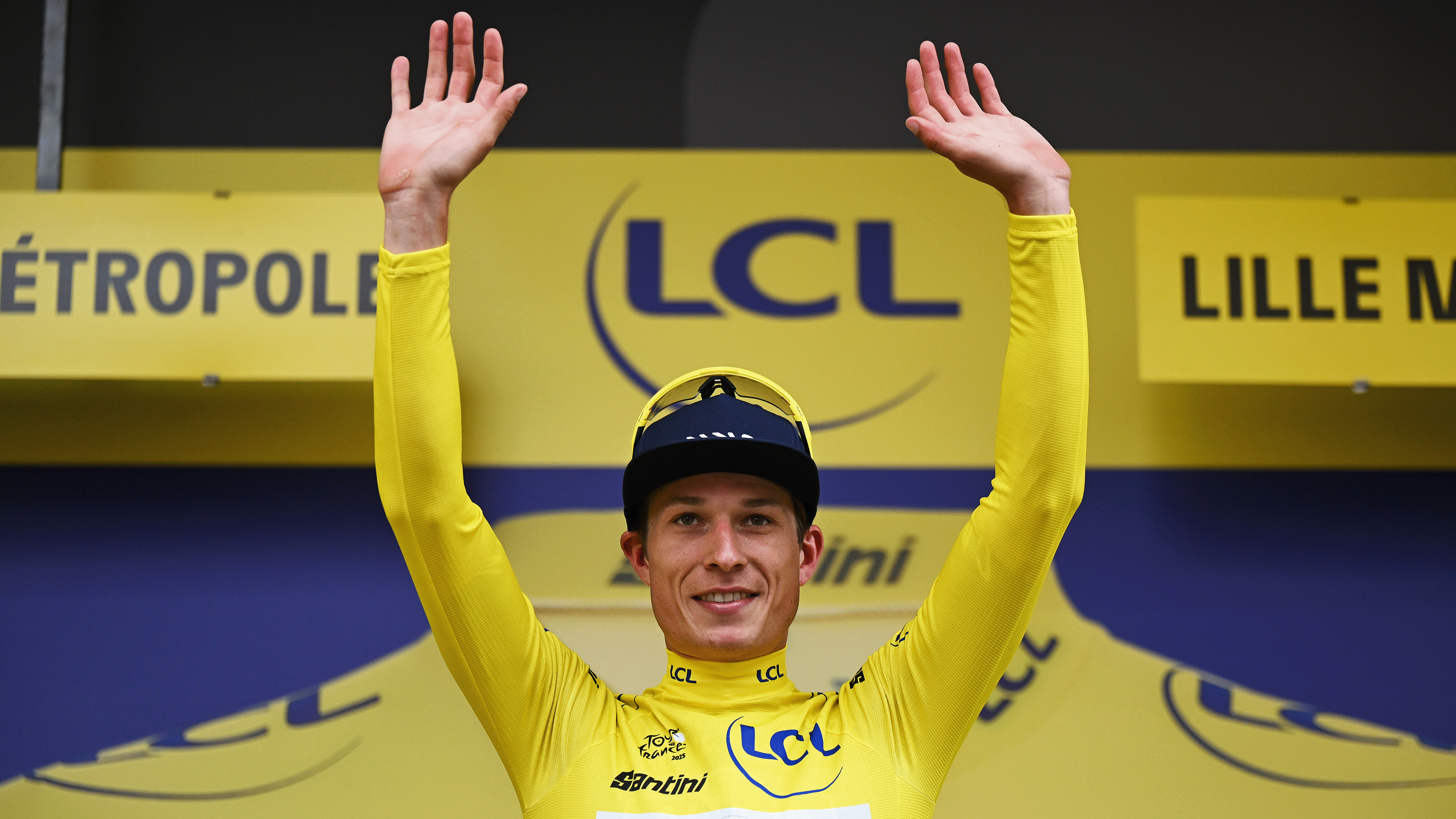 LILLE, FRANCE - JULY 05: Jasper Philipsen of Belgium and Team Alpecin - Deceuninck celebrates at podium as Yellow Leader Jersey winner with the Lion Mascot during the 112th Tour de France 2025, Stage 1 a 184.9km stage from Lille to Lille / #UCIWT / on July 05, 2025 in Lille, France. (Photo by Tim de Waele/Getty Images)