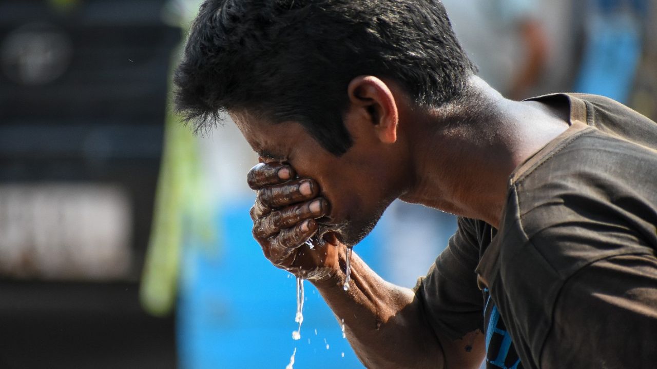 A man tries to escape from a severe heatwave in Kolkata, India