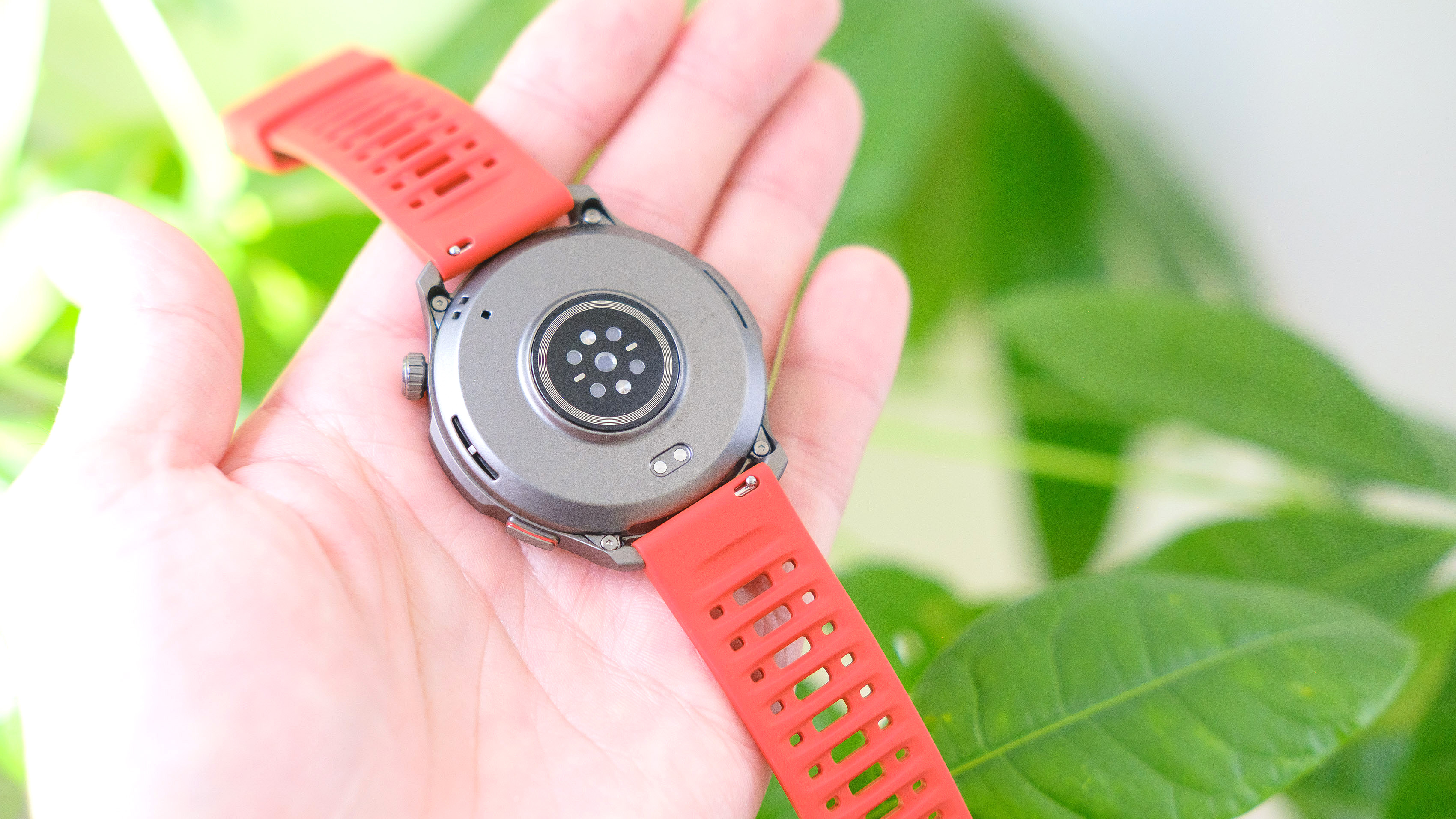 Close-up of the Amazfit Balance 2 smartwatch on an orange rubber strap