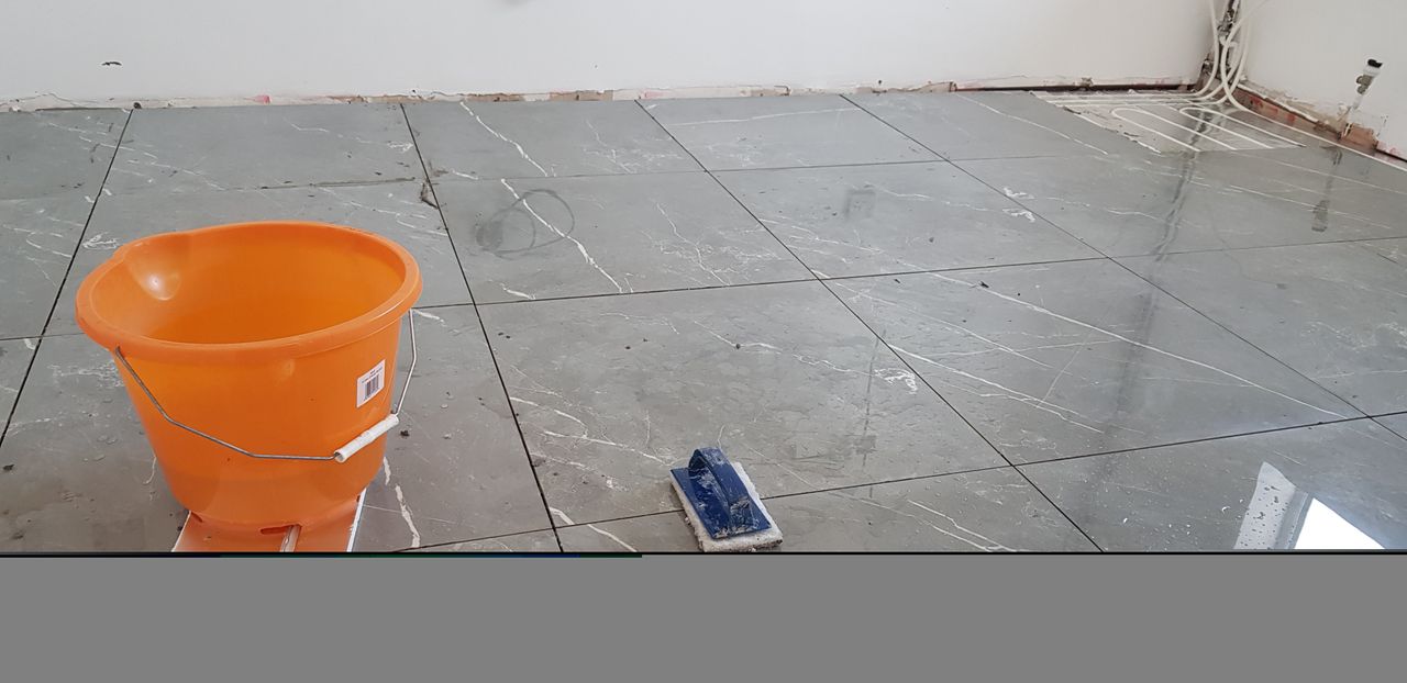 Tiling over underfloor heating retrofitted into a bathroom