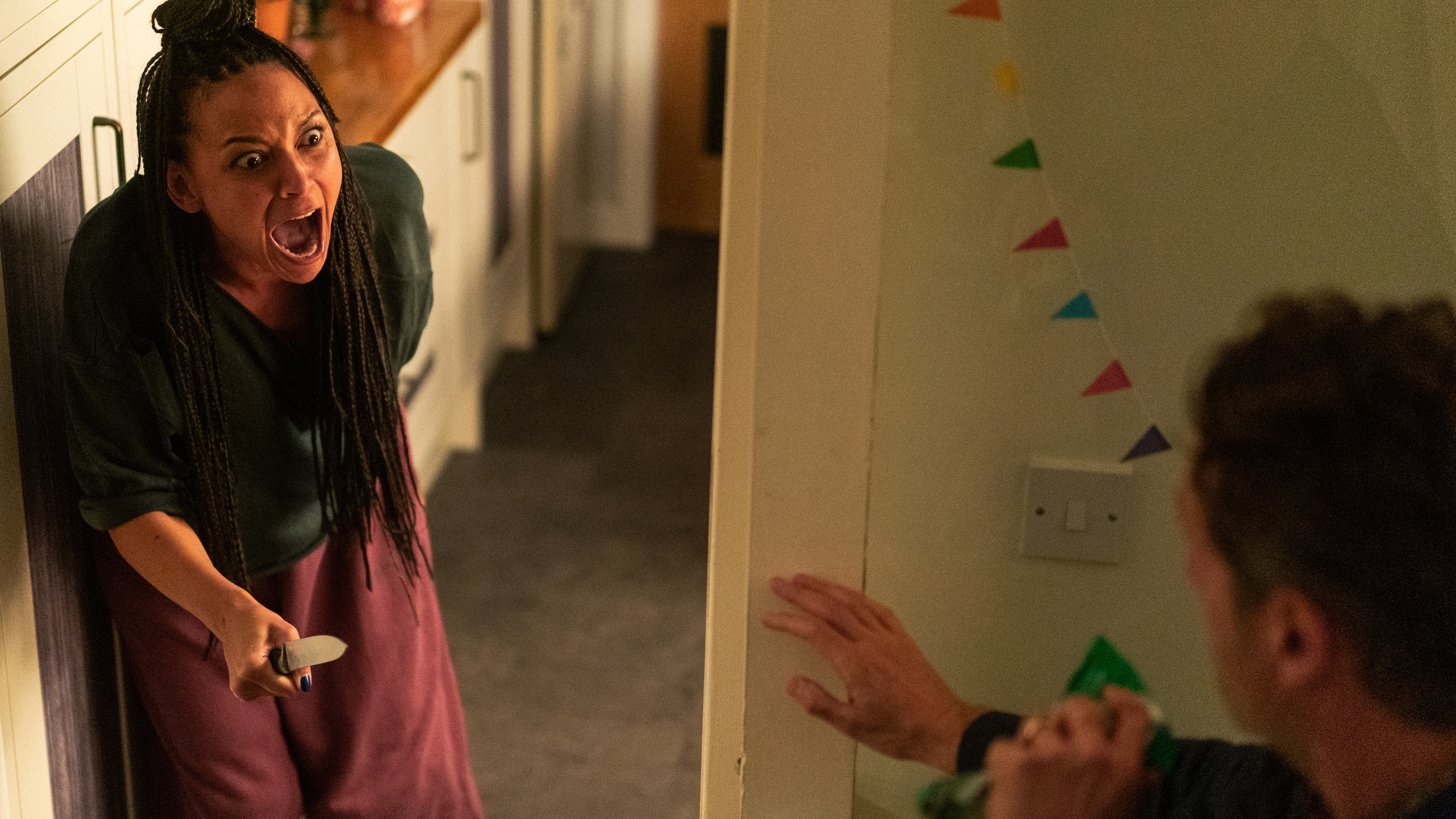 Catriona (Lois Chimimba) threatens John (Andrew Lincoln) with a knife