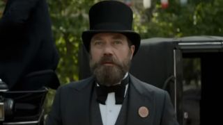 Michael Shannon with a beard, wearing a suit and top hat in Death by Lightning