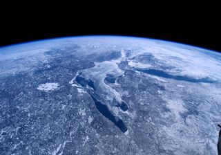 A scene from the IMAX film "A Beautiful Planet." In this image, the great lakes of North America lie trapped in ice and snow.