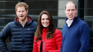 Britain's Catherine, Duchess of Cambridge (C), Britain's Prince William, Duke of Cambridge, (R) and Britain's Prince Harry (L) look down the track as they attend a training event to promote the charity Heads Together, at the Queen Elizabeth Olympic Park in London