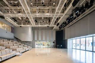 Sukagawa Community Center and its bright and open auditorium space with exposed ceiling structure