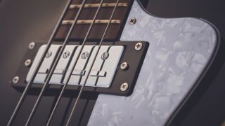 Close up of a humbucker pickup on a bass guitar