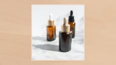 Image of a trio of serums in a pale beige frame set against a warm beige watercolour-style background